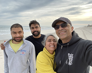 Madhav Swaminathan with his family at the beach.