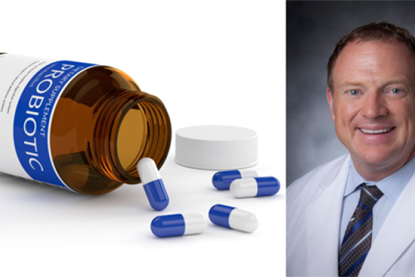 Dr. Paul Wischmeyer pictured with a turned over pill bottle.