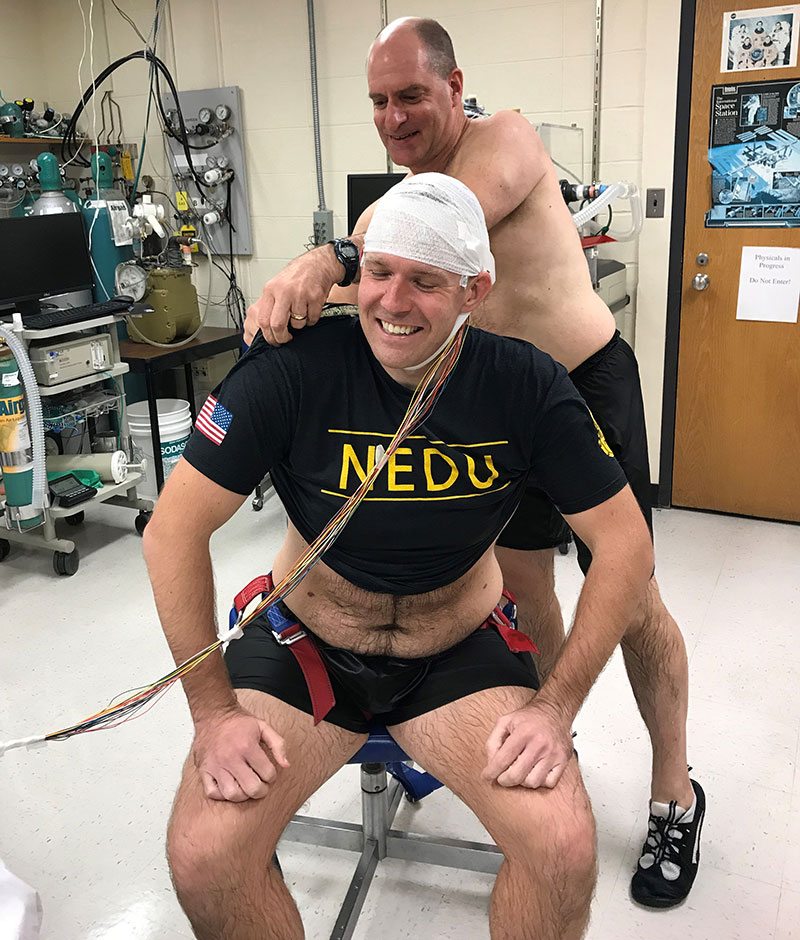 USN physician and Duke Hyperbaric Fellow, Brian Keuski, MD, trying out the EEG for Dr. Bruce Derrick’s NAVSEA Oxygen Toxicity study.