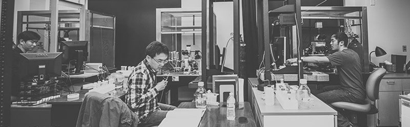 Black & White photo of lab researchers in lab