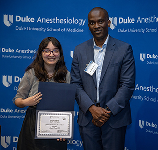 Jen Ricano at the 2024 Academic Evening with her award and Guest Judge Dr. Seun Johnson-Akeju
