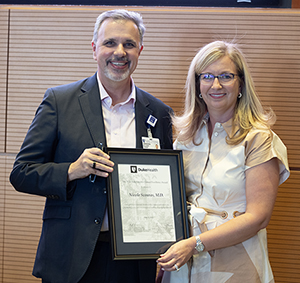 President, Duke Health Integrated Practice (DHIP) & Vice Dean for Clinical Affairs, School of Medicine, Dr. Matthew Barber, with Faculty Award recipient, Dr. Nicole Scouras.
