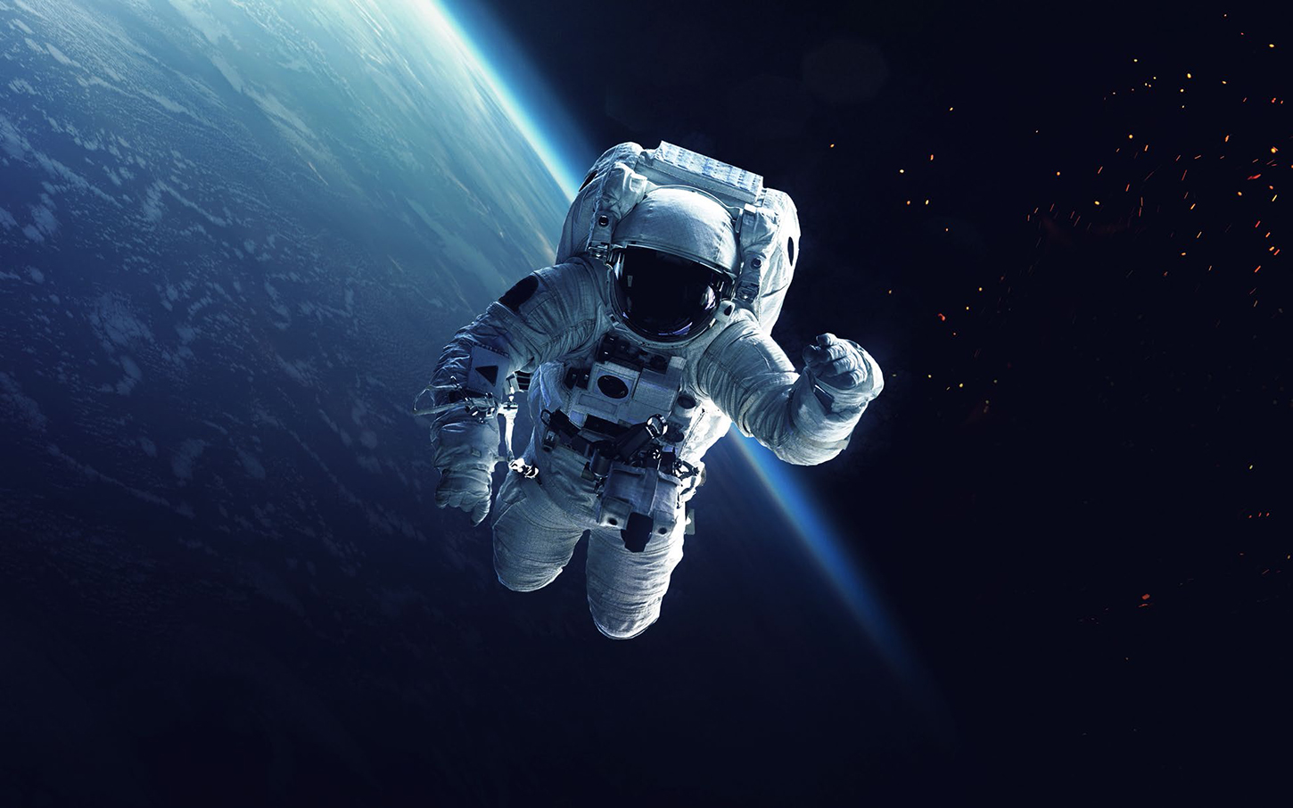 Astronaut in space with Earth in the background.