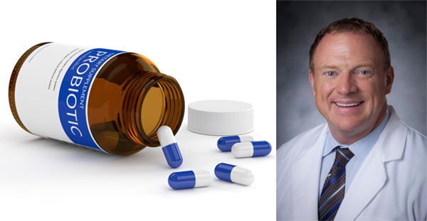 Dr. Paul Wischmeyer pictured with a turned over pill bottle.