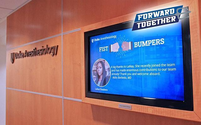 Duke Anesthesiology Fist Bumpers displayed on a TV monitor