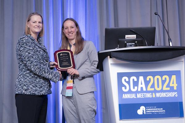 Anne Cherry receiving her award at the 2024 SOAP meeting.