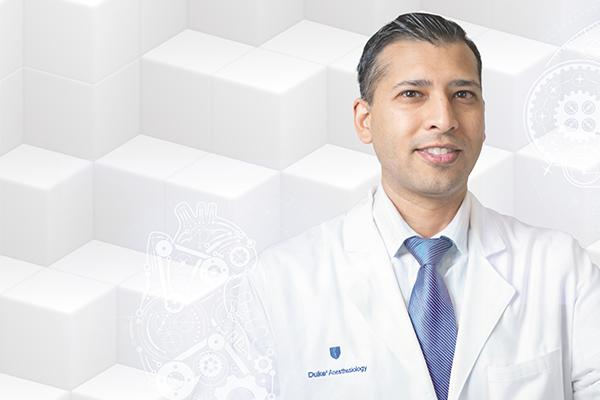 Dr. Neal Ray in front of an abstract step background