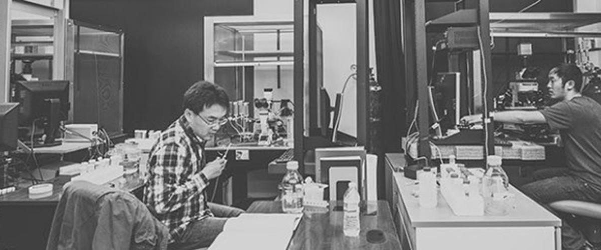 Black & White photo of lab researchers in lab