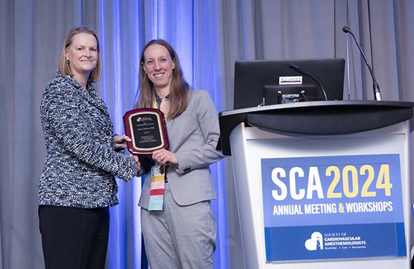 Anne Cherry receiving her award at the 2024 SOAP meeting.