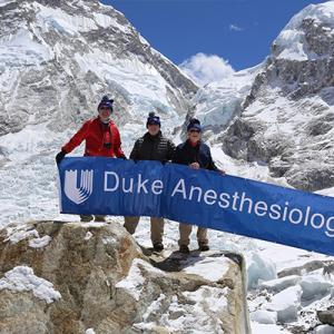 Everest Base Camp with Drs. Chris Young, Gene Moretti, Richard Moon, and Peter Moon on far right.