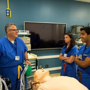 Dr. Taekman with students in the Simulation lab