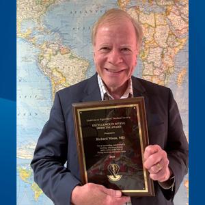 Dr. Richard Moon with his Excellence in Diving Medicine Award